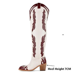 Close-up of heel height on western flame embellished block heel boots