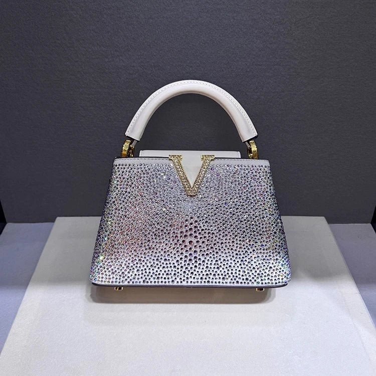 White crystal embellished structured bag with top handle.
