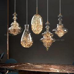 Lifestyle image showcasing the brass chandelier hanging above a bar, creating a sophisticated ambiance. Golden Atelier 3