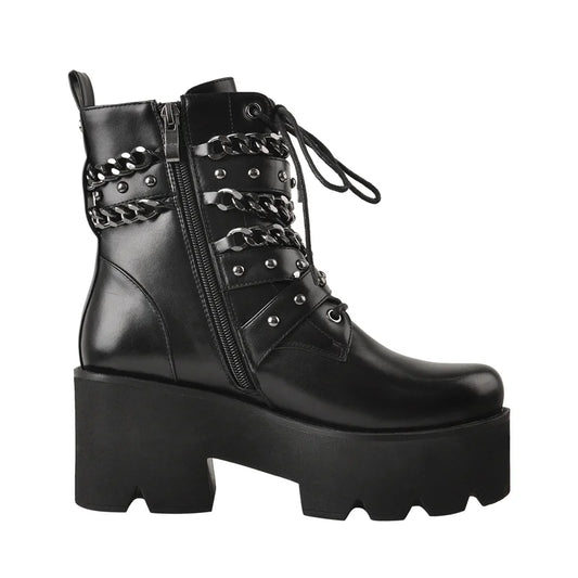 Side view of black chunky platform chain detail ankle boots