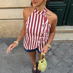 Red and white striped sleeveless top with lace-up front on a plain background