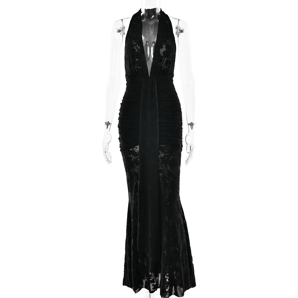 Black evening gown on a mannequin against a white background