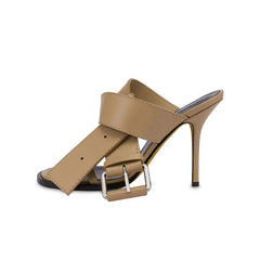 Side view of nude buckle strap stiletto mule