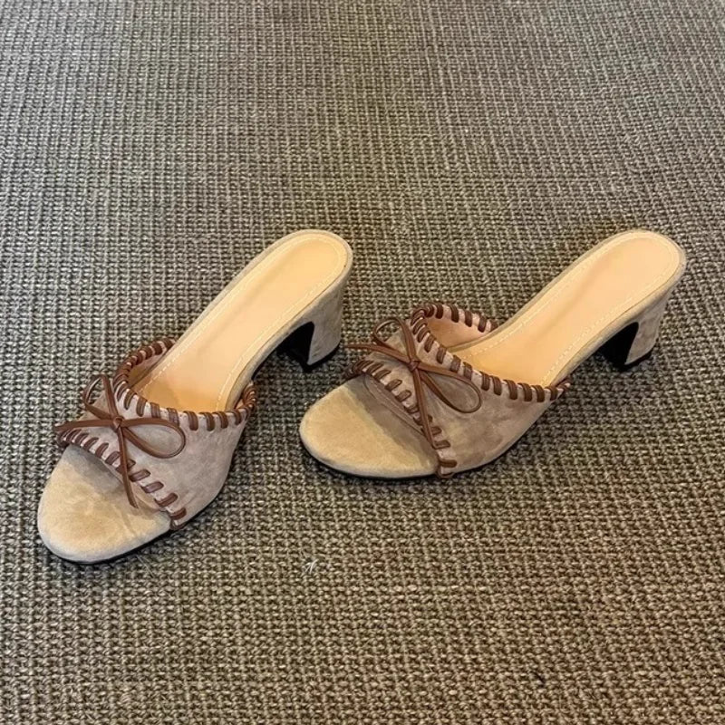 Khaki open toe square heel mules with stitched trim and bow detail
