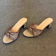 Khaki open toe square heel mules with stitched trim and bow detail