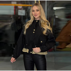 Model wearing a black drawstring waist jacket