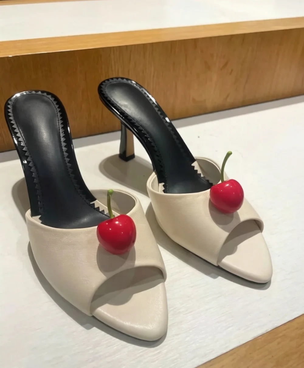 Pink satin pointed toe stiletto sandals with cherry accent