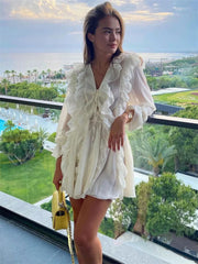 Ruffled lace-up mini dress with resort background