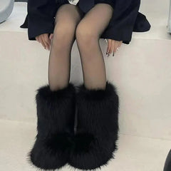 Woman wearing Fluffy Faux Fox Fur Winter Boots from Golden Atelier, showcasing the full boot and fur details.