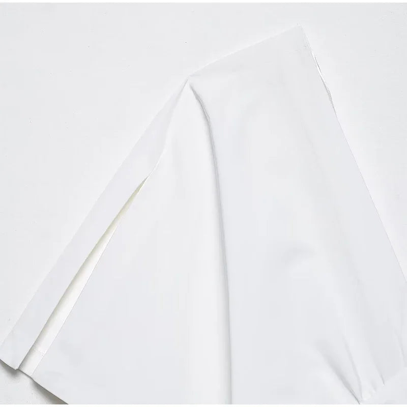 White fabric with a subtle pattern on a white background