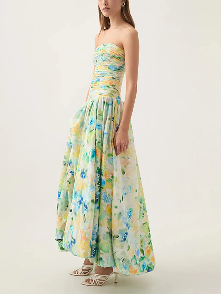 Woman wearing a strapless floral dress on a white background