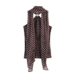 Polka dot dress with a unique cutout design on a white background