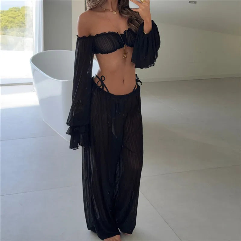 Black off shoulder ruffle crop top and wide leg pants set in bathroom
