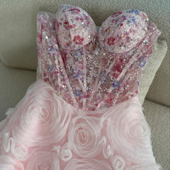 Pink strapless floral prom gown with beaded bodice and tulle court train