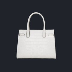 A close-up image of a White leather handbag, emphasizing the softness and quality of the material.