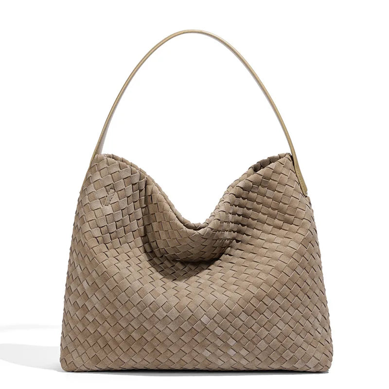 Beige woven handbag on a white background
