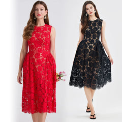 Two women wearing red and black lace dresses on a white background