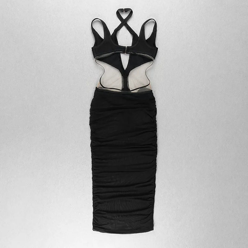 Black dress with unique cut-out design on a light gray background