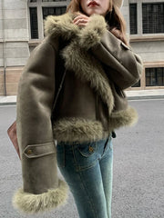 A model wearing a brown cropped faux suede jacket with a biker design and zipper detailing. Golden Atelier 4