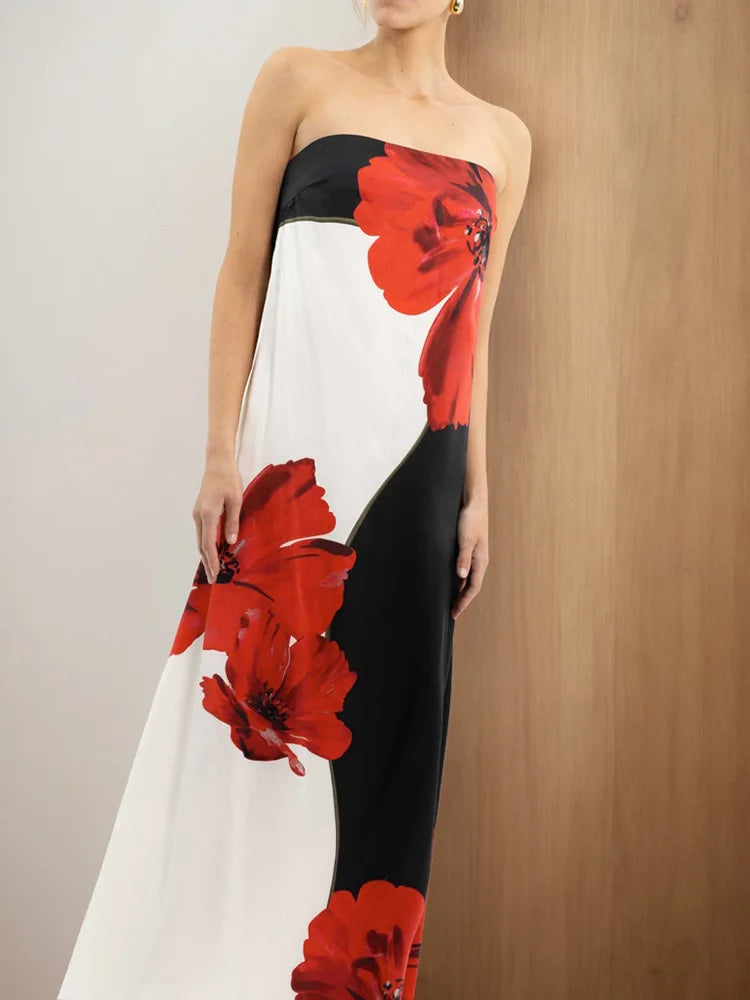 Woman wearing a strapless dress with red floral patterns 