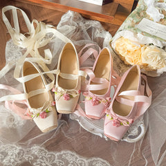 Pair of pink and apricot ballet flats with satin ribbons