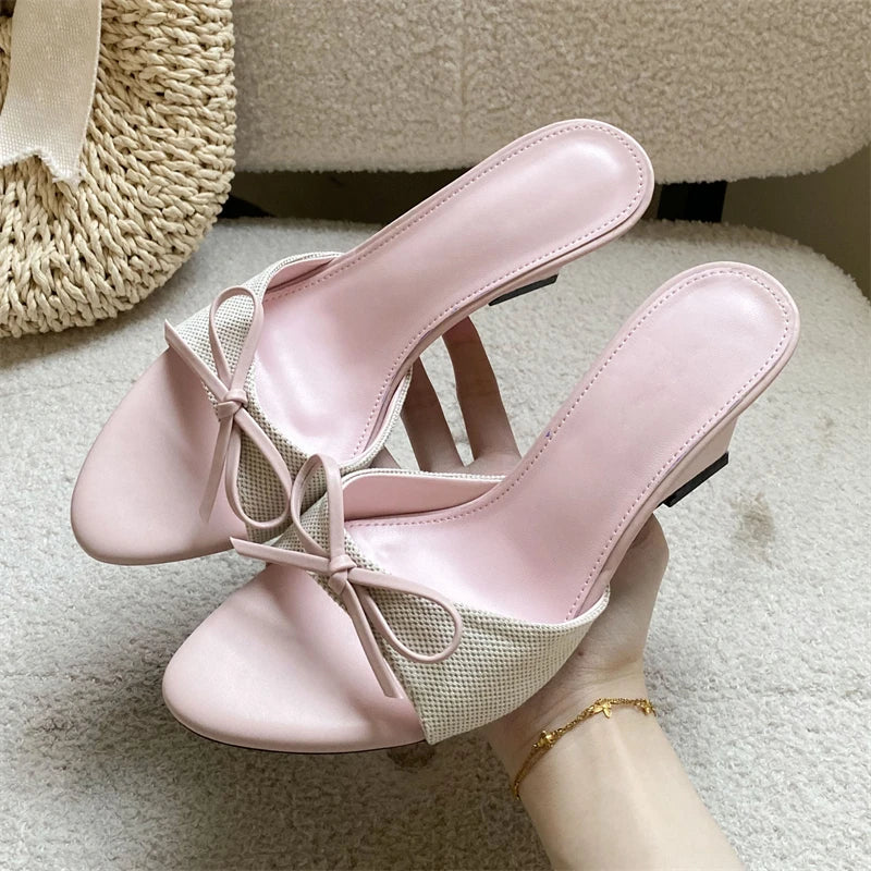 Pink bow wedge mules