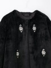 Women's fuzzy cardigan with long sleeves.