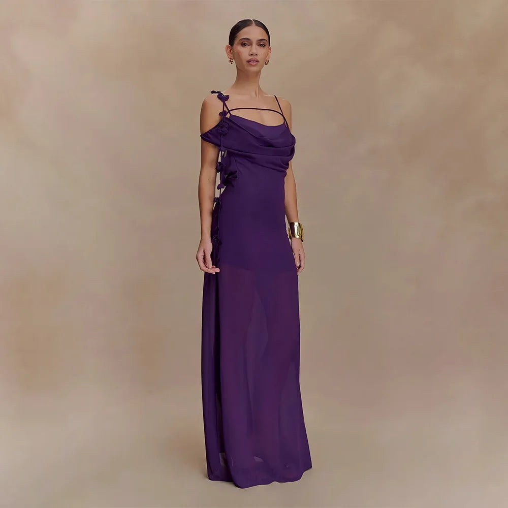 Woman wearing a purple evening gown against a beige background
