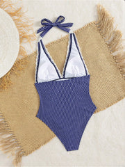 Back view of polka dot one-piece swimwear