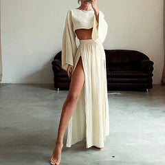  A model wearing a cotton linen two-piece set with a flare sleeve top and a slit long skirt. Golden Atelier 1