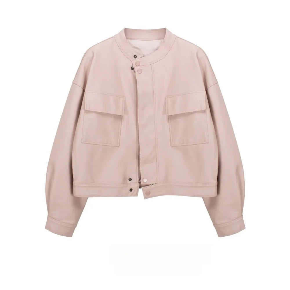 Pink cropped faux leather jacket with round neck and dual front pockets.