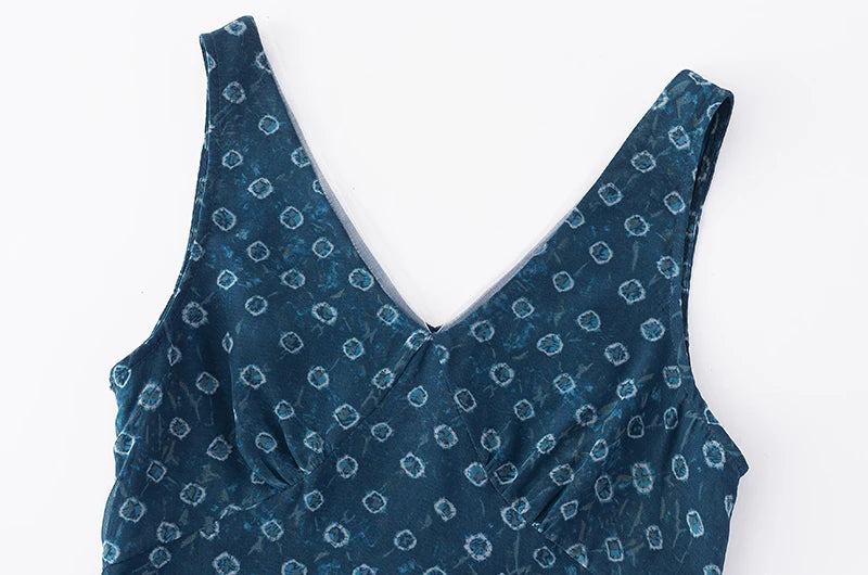 Close-up of the V-neckline on a sleeveless mini dress with geometric print