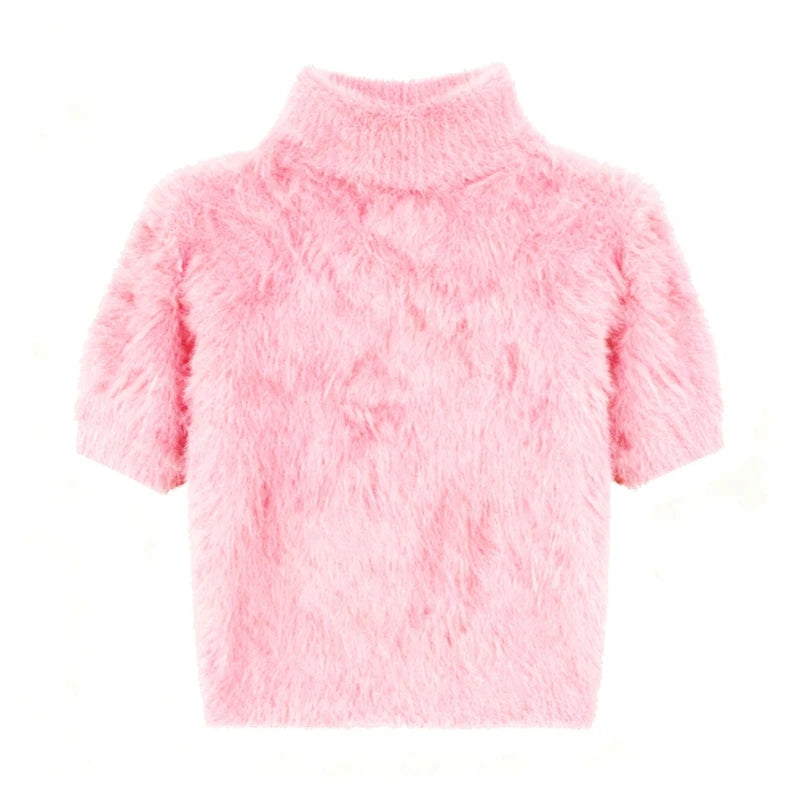 Pink fluffy sweater on a white background