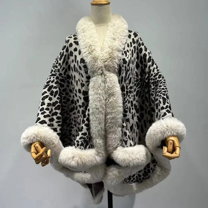 Leopard print coat with white fur trim on a mannequin against a gray background
