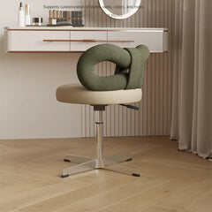 Cream and Green -colored makeup chair with a delicate bow accent, showcasing its minimalist design and comfortable upholstery. Golden Atelier 3