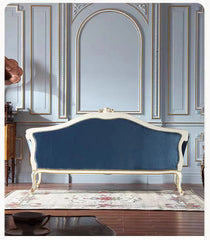 Blue sofa with white frame in a decorated room