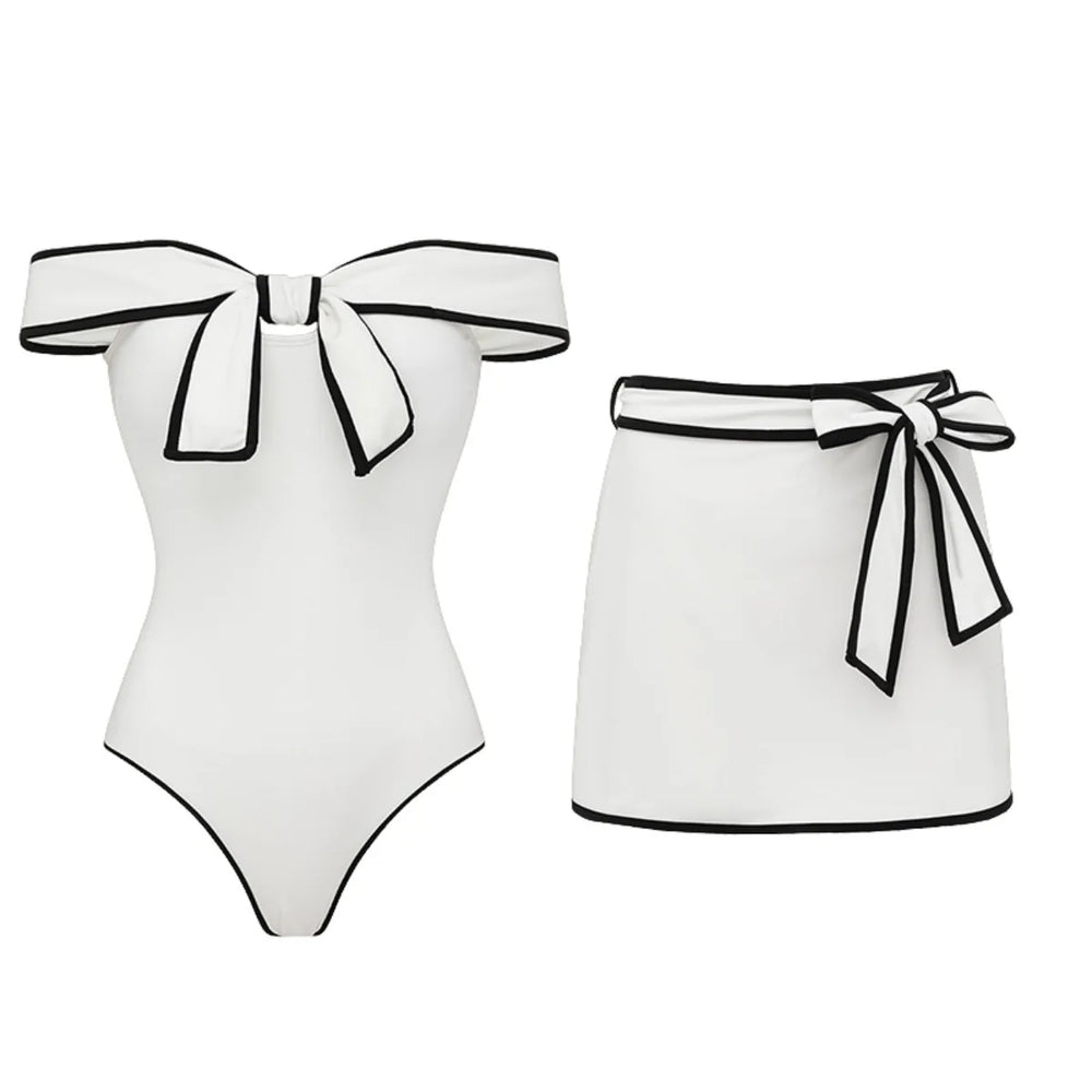 White off-the-shoulder swimsuit and wrap skirt set with contrast trim