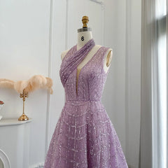 Mannequin displaying  the lilac beaded evening gown, showcasing its elegant silhouette and flowing train. Golden Atelier 3