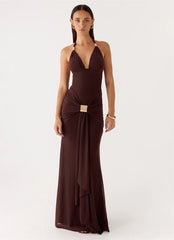 Woman wearing a brown evening gown on a white background