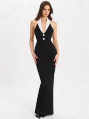 Woman wearing a black and white evening gown on a white background