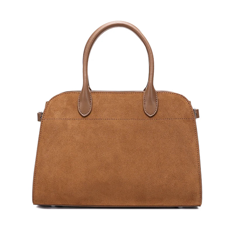 Brown handbag with leather handles on a white background