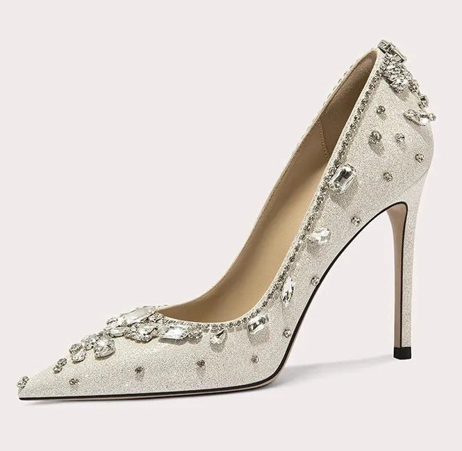 High-heeled shoe with crystal embellishments on a light background
