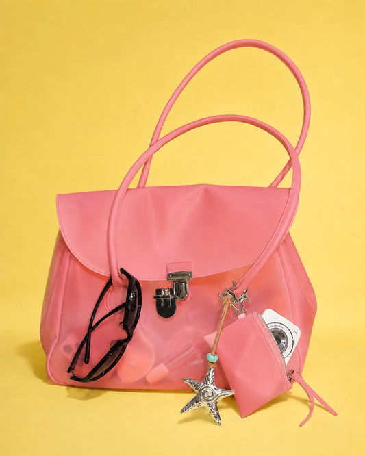 Transparent tote bag with sunglasses and coin purse
