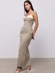Side view of contrast plaid maxi dress with spaghetti straps.