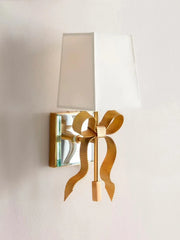 Modern retro bow-shaped  LED wall lamp in Pink and gold finish with a fabric shade. Golden Atelier 2