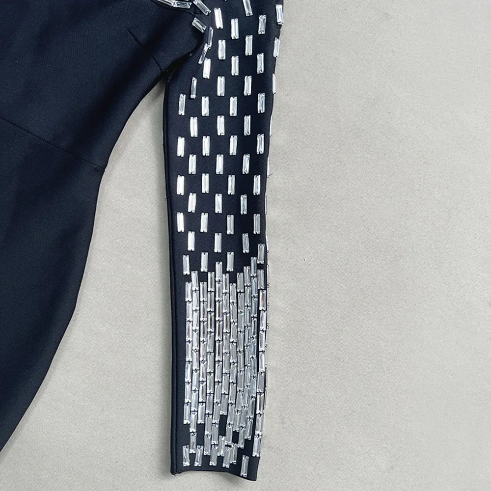 Navy blue fabric with silver geometric pattern on a light gray background