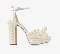 Close-up of a Golden Atelier handmade pearl fish mouth platform heel, highlighting the intricate pearl embellishments.3