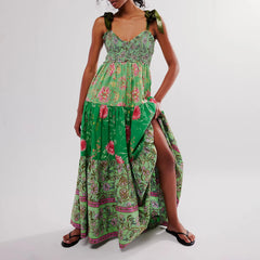 Woman wearing a green floral dress on a white background