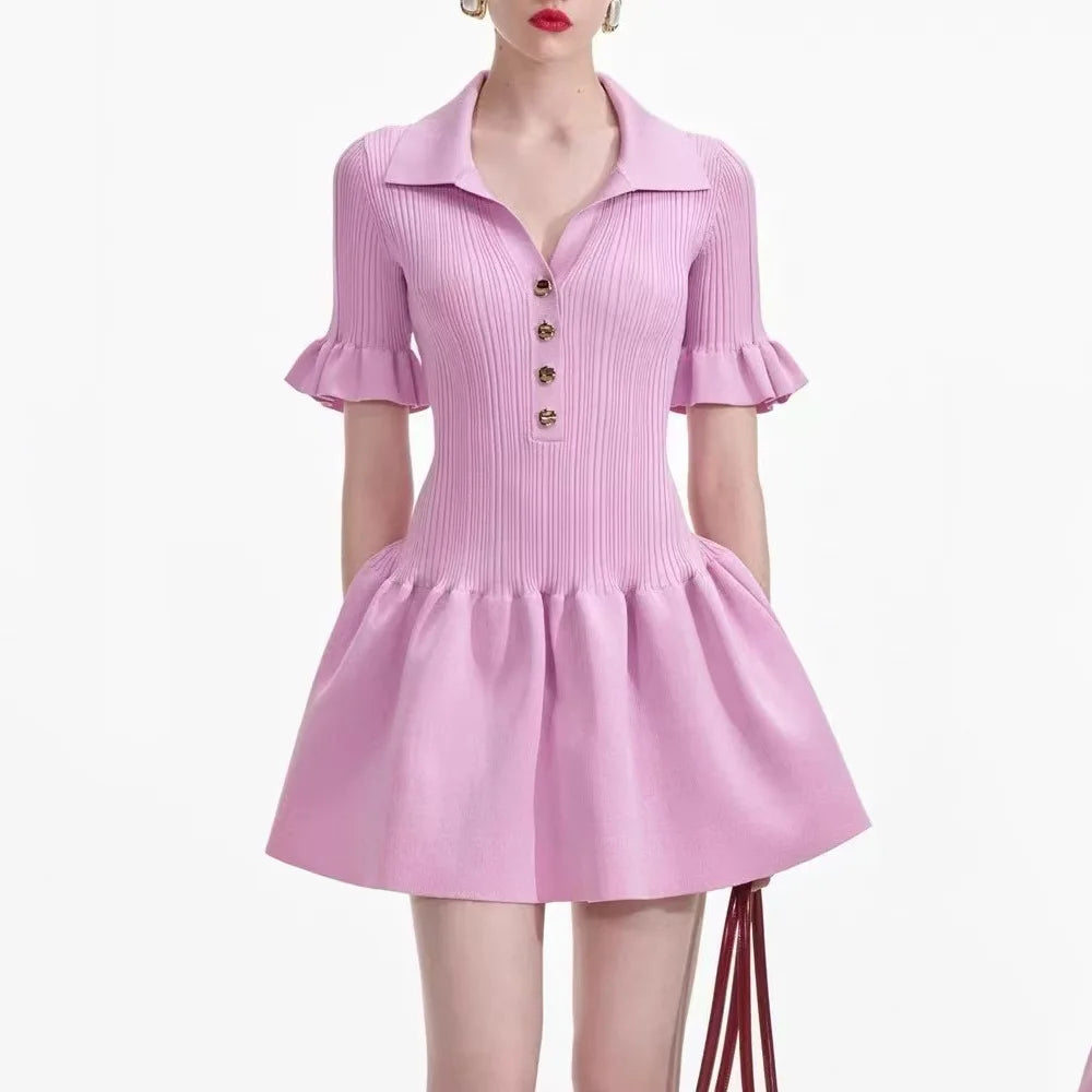 Pink dress with ruffled sleeves on a white background