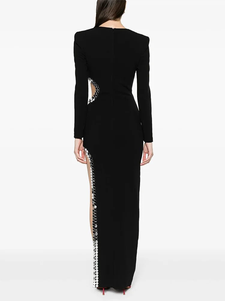 Back view of black long sleeve maxi dress with cutout detail